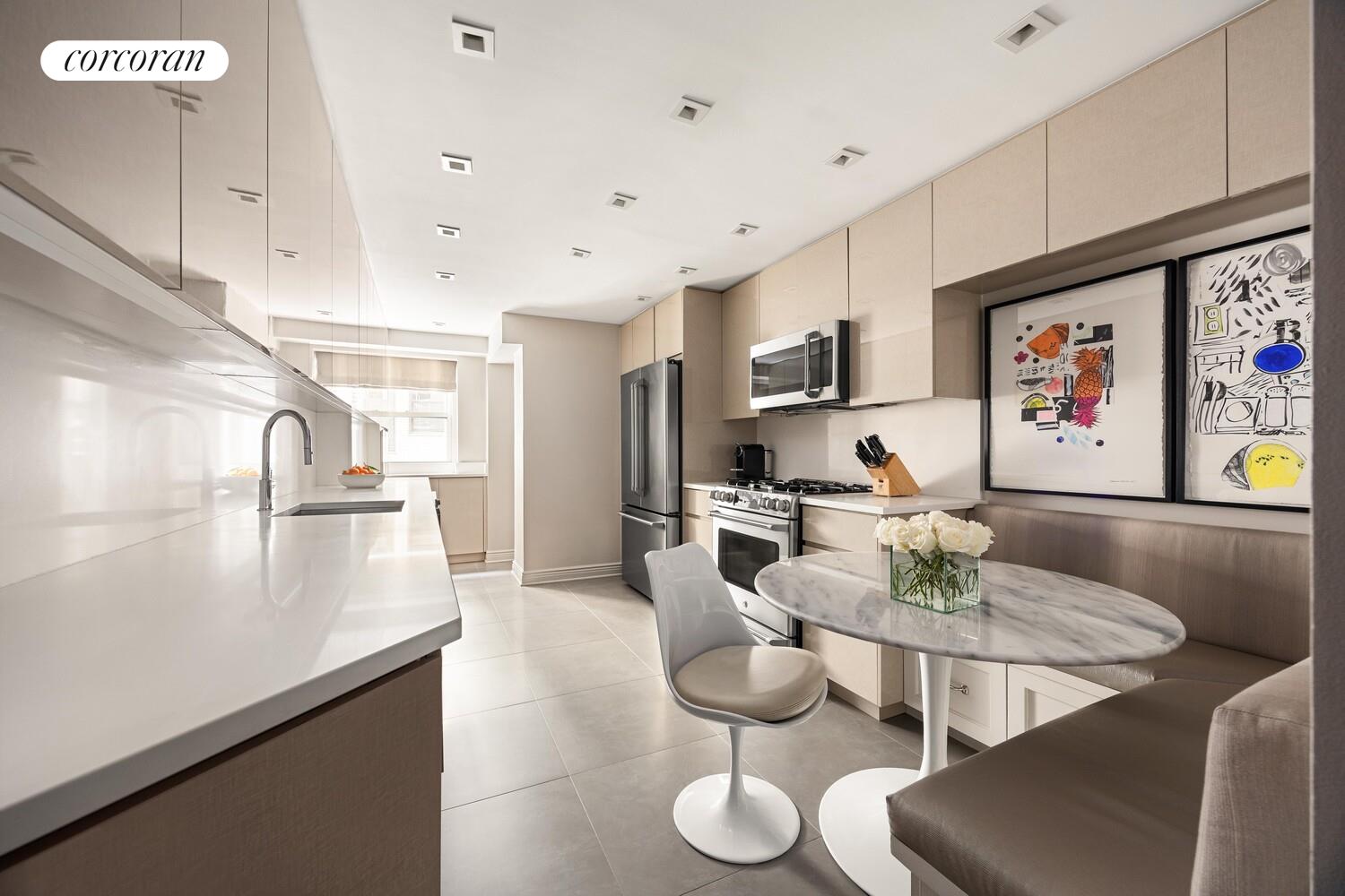 220 East 73rd Street, Unit 6D Manhattan, NY 10021 - Photo 6 of 19 a living room with furniture and kitchen view