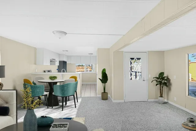 a view of a livingroom with furniture window and wooden floor