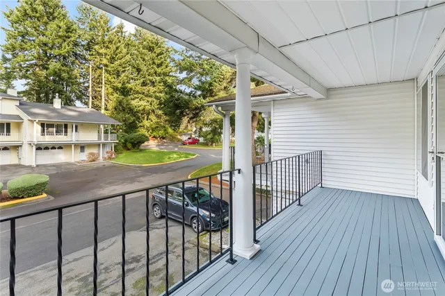 a view of a house with wooden deck