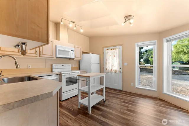 a kitchen that has a cabinets counter space and a stove