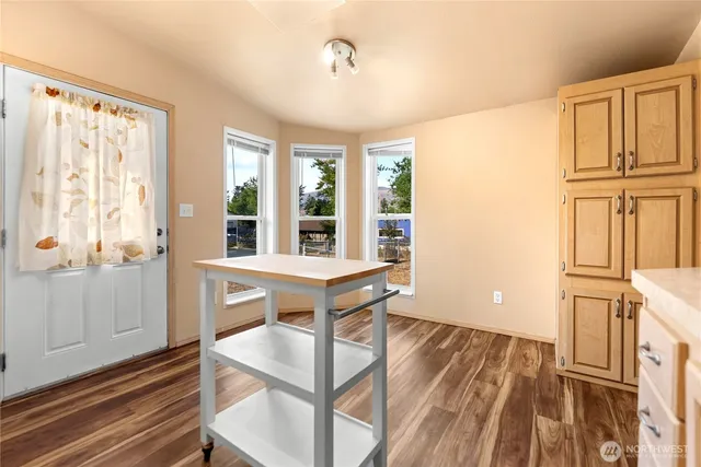 a view of a livingroom with furniture window and wooden floor