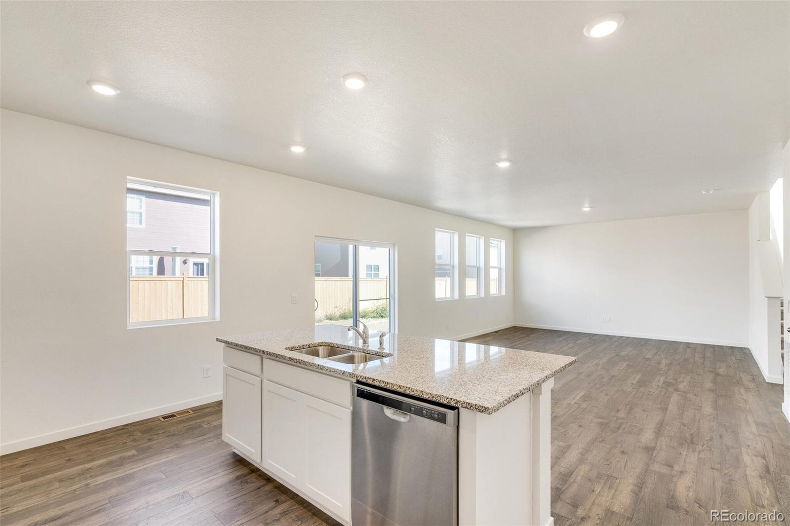3058 Belleville Ridge Road Elizabeth, CO 80107 - Photo 14 of 31 a kitchen with granite countertop sink and cabinets