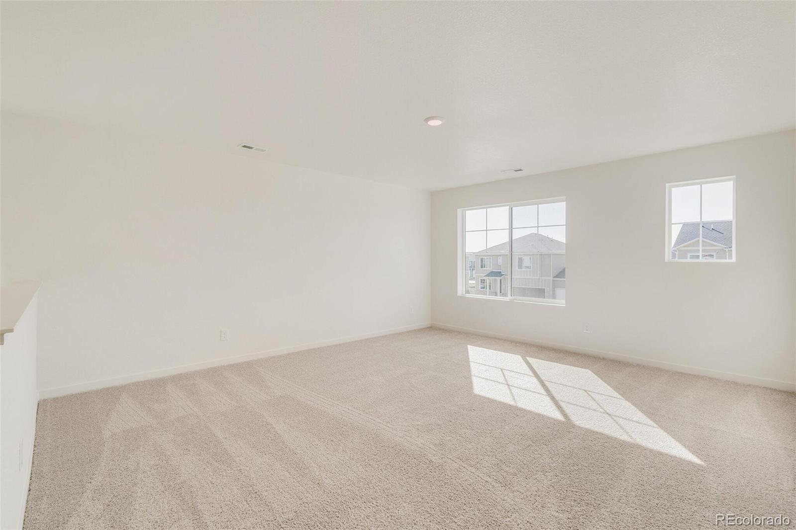 3058 Belleville Ridge Road Elizabeth, CO 80107 - Photo 18 of 31 an empty room with windows