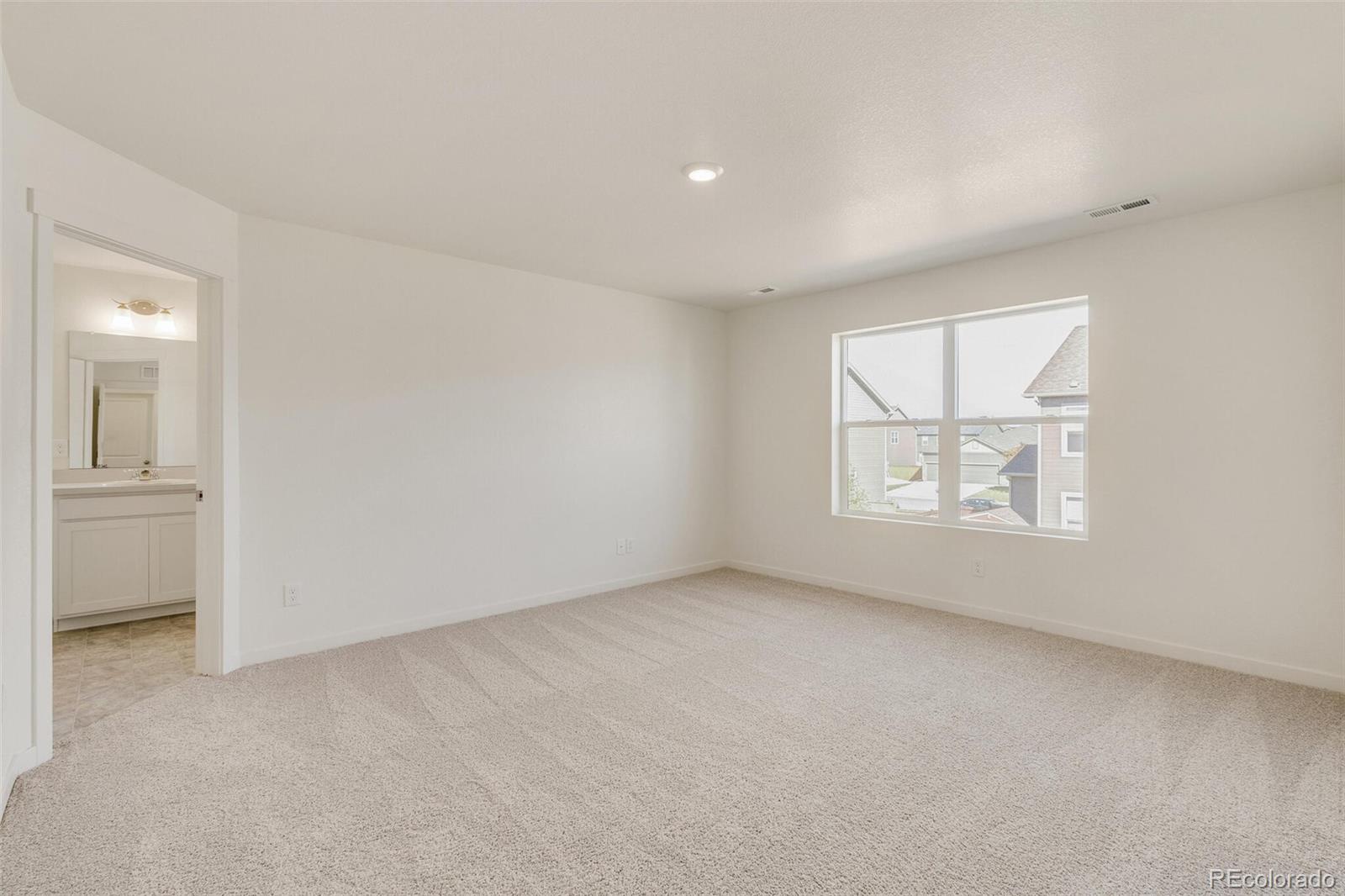 3058 Belleville Ridge Road Elizabeth, CO 80107 - Photo 20 of 31 an empty room with windows and closet