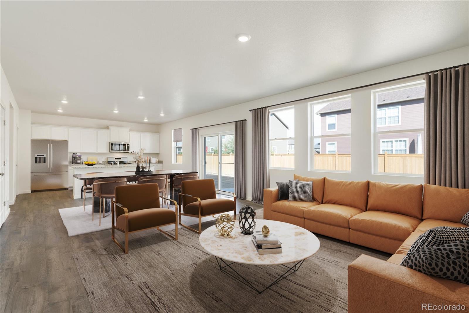 3058 Belleville Ridge Road Elizabeth, CO 80107 - Photo 2 of 31 a living room with furniture kitchen view and a large window
