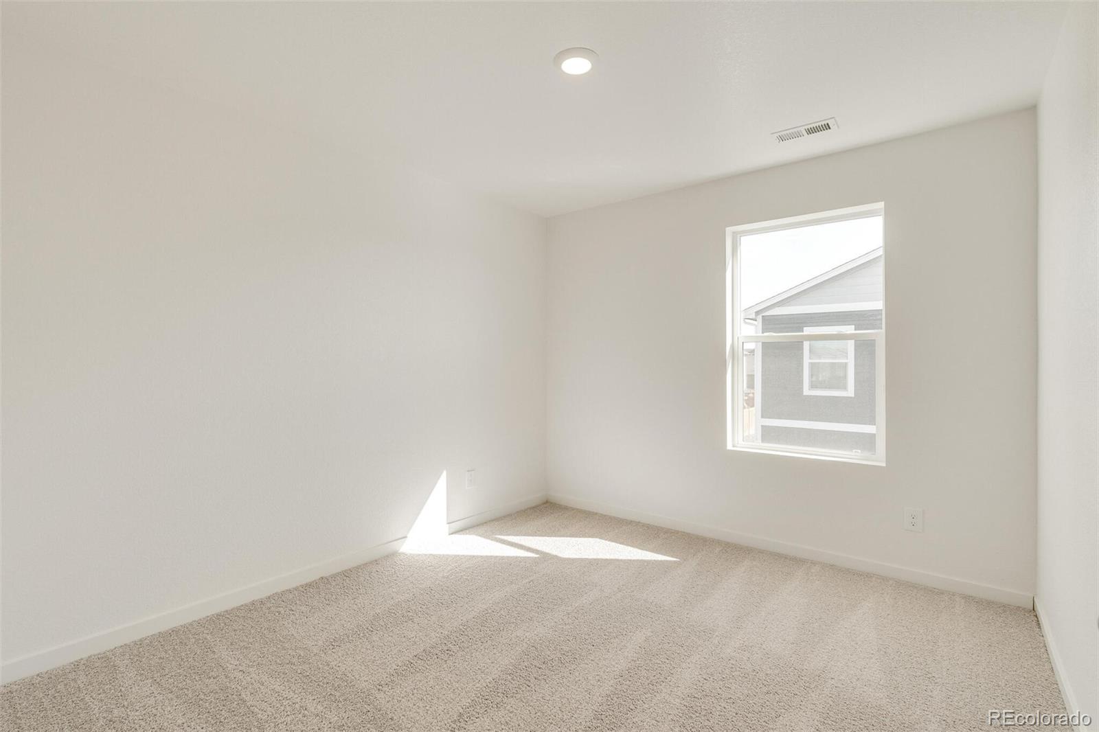 3058 Belleville Ridge Road Elizabeth, CO 80107 - Photo 24 of 31 an empty room with a window