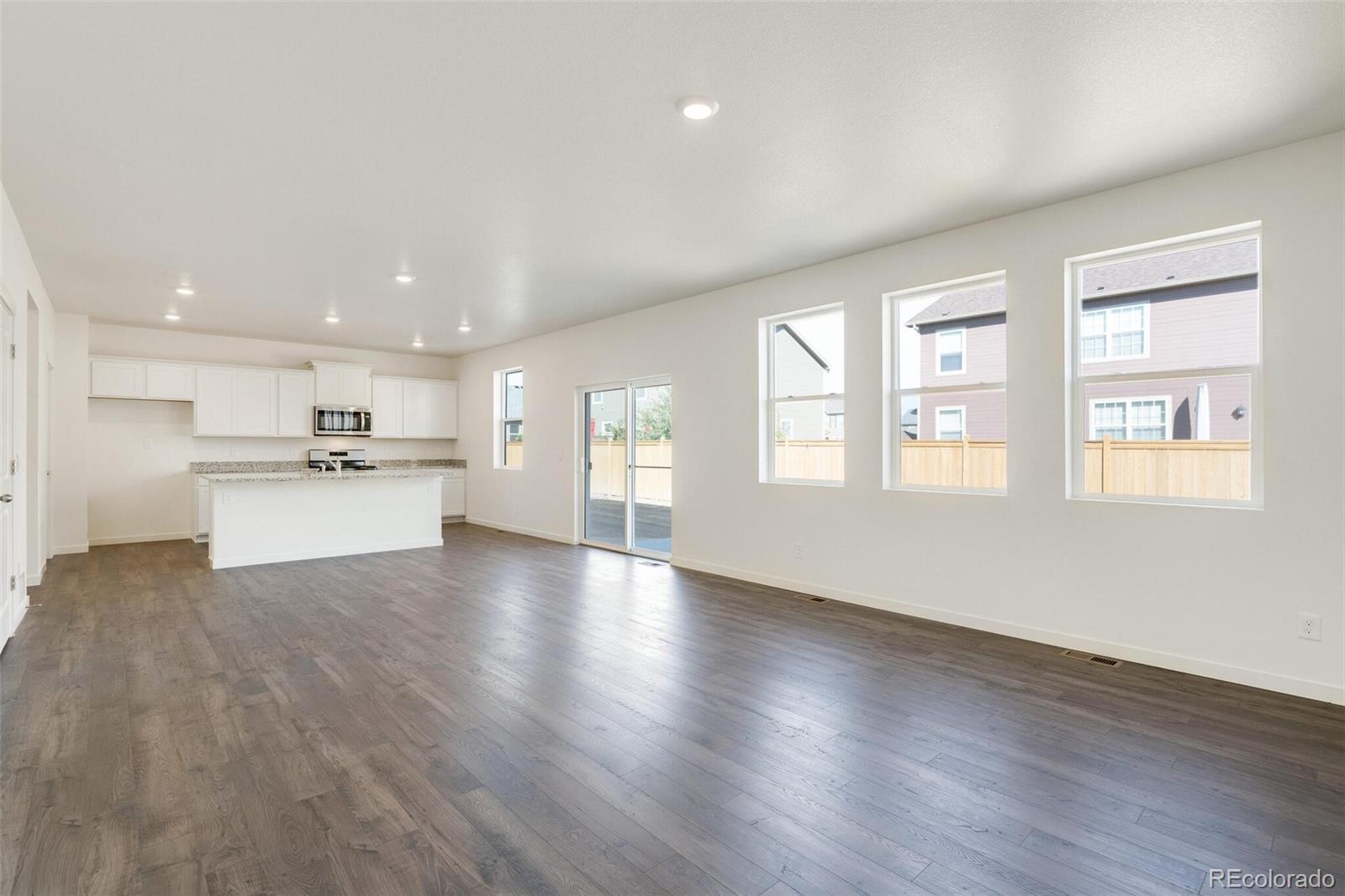 3058 Belleville Ridge Road Elizabeth, CO 80107 - Photo 6 of 31 a view of kitchen with wooden floor and windows