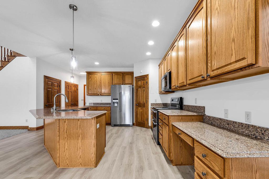 330 Longshore Road Sunbury, OH 43074 - Photo 12 of 73 42" Hardwood cabinets, pantry, desk, large, sitting, Island with sink and all new Maytag appliances