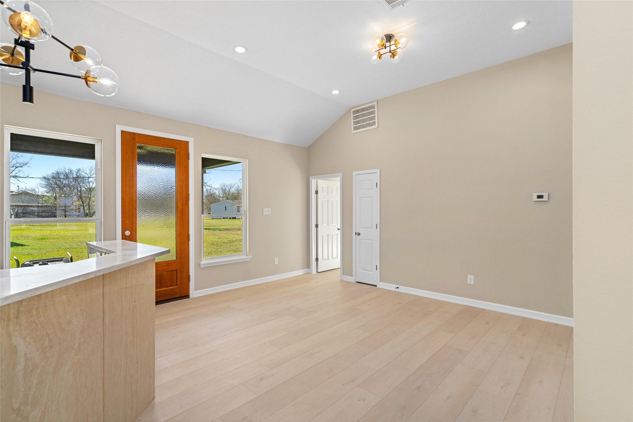 4654 North Teague Street Rosharon, TX 77583 - Photo 14 of 46 Sunlight streams through
multiple windows,
illuminating the dining nook
and offering picturesque
views of the lush backyard,
ideal for indoor-outdoor
living.