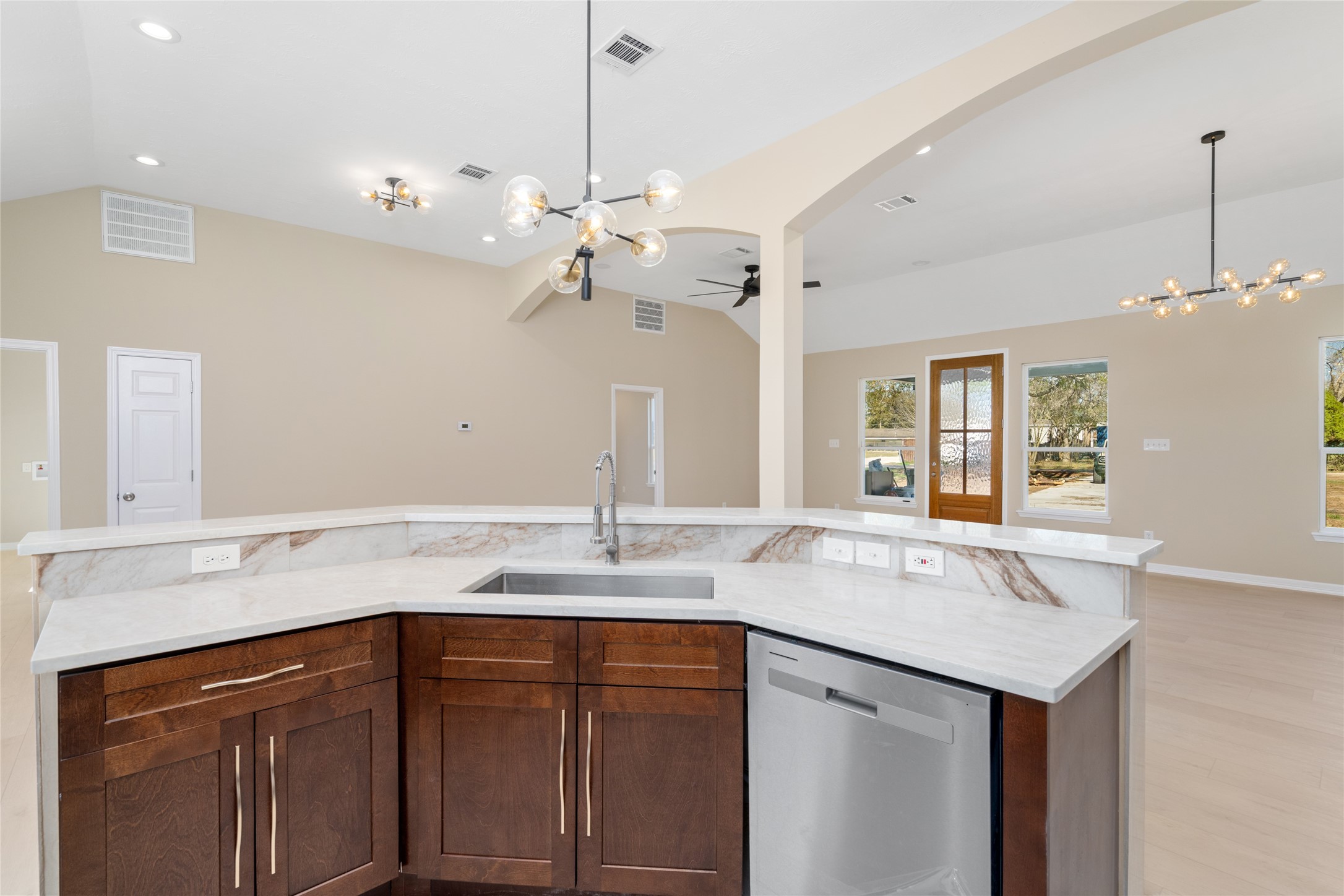 4654 North Teague Street Rosharon, TX 77583 - Photo 21 of 46 From this angle, the kitchen
island shines as the
centerpiece, ideal for meal
prep, casual dining, or
gathering with loved ones