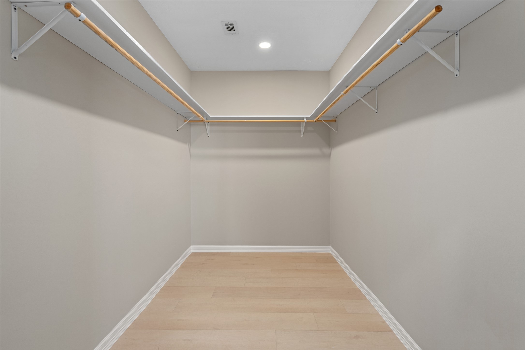 4654 North Teague Street Rosharon, TX 77583 - Photo 33 of 46 Expansive walk-in closet with
high ceilings and ample
shelving. Organized luxury
meets everyday convenience.