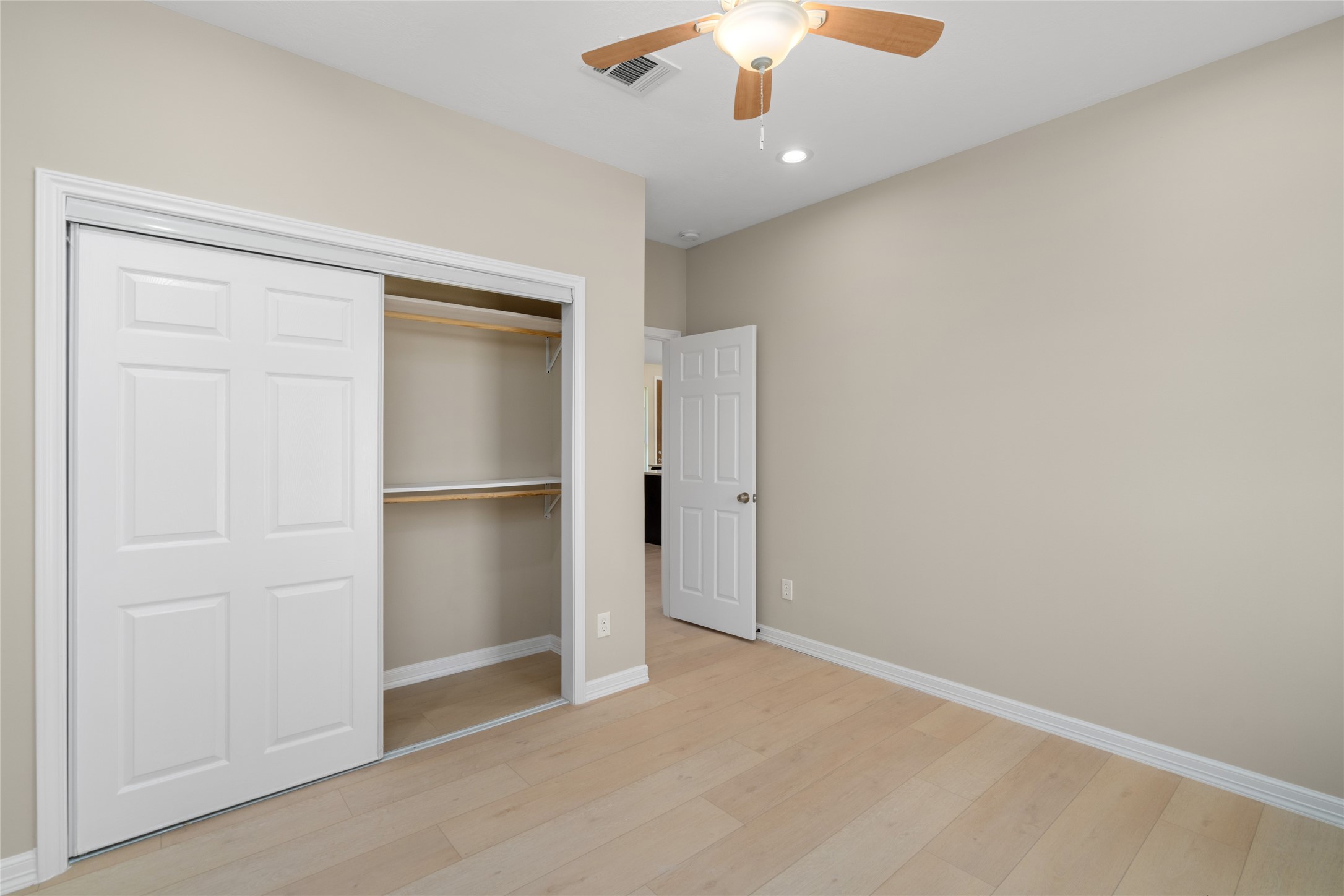 4654 North Teague Street Rosharon, TX 77583 - Photo 37 of 46 Spacious bedroom with generous closet space and a clean, modern palette. A perfect canvas for any style.