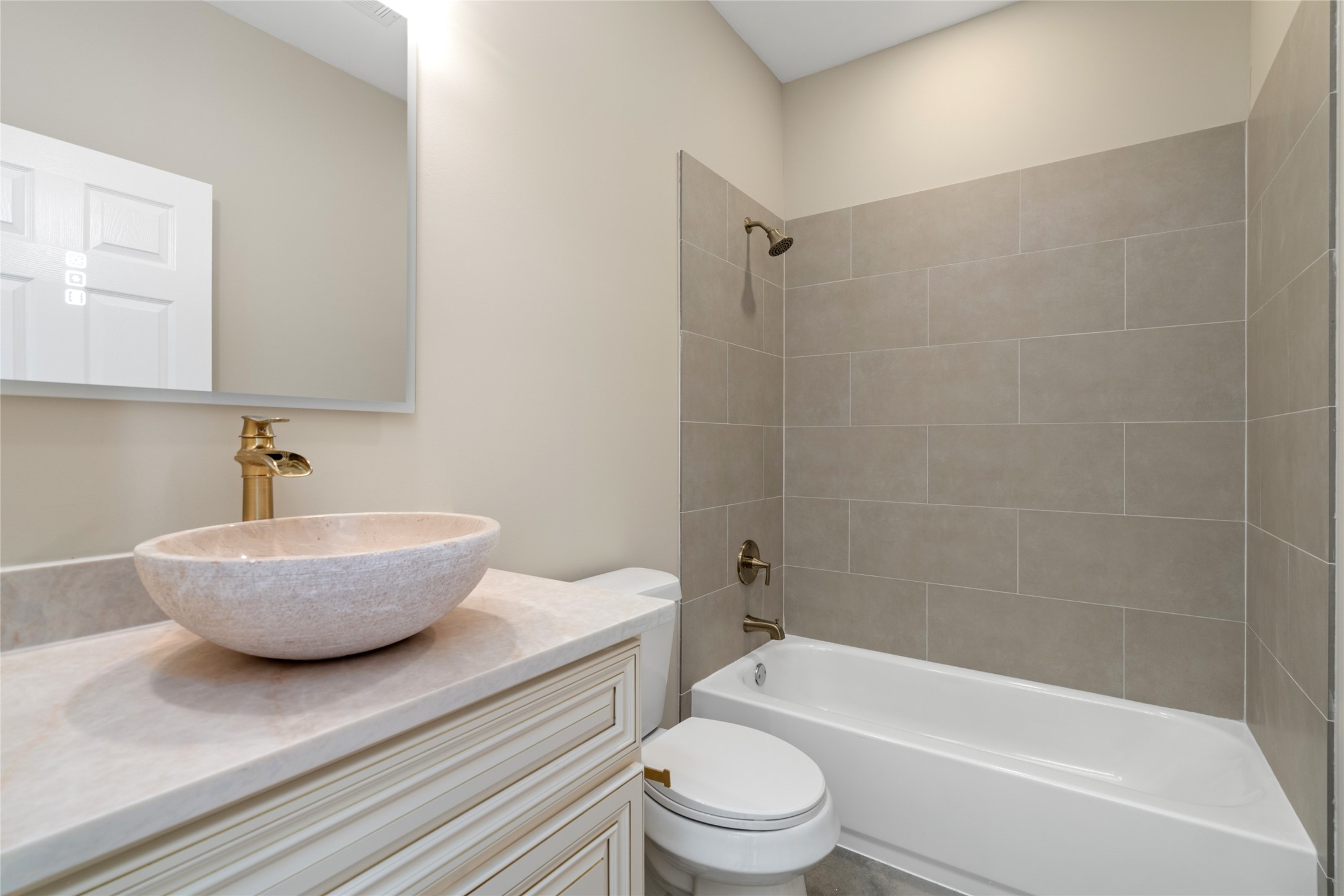 4654 North Teague Street Rosharon, TX 77583 - Photo 38 of 46 Full guest or secondary bathroom with stylish vessel sink and contemporary tilework. Functional yet beautifully designed.