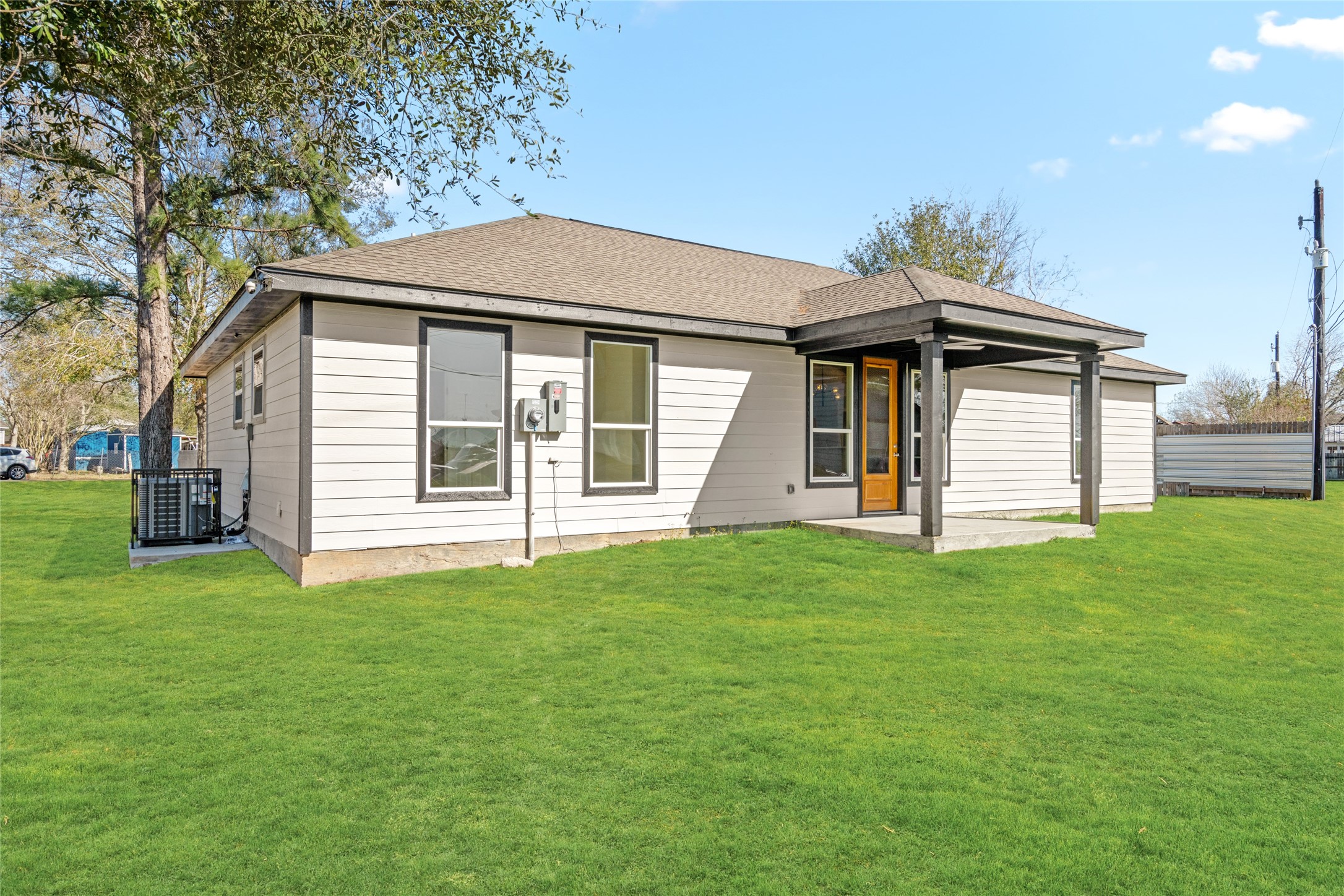 4654 North Teague Street Rosharon, TX 77583 - Photo 42 of 46 Another angle of the backyard highlighting the open green space and charming modern exterior.