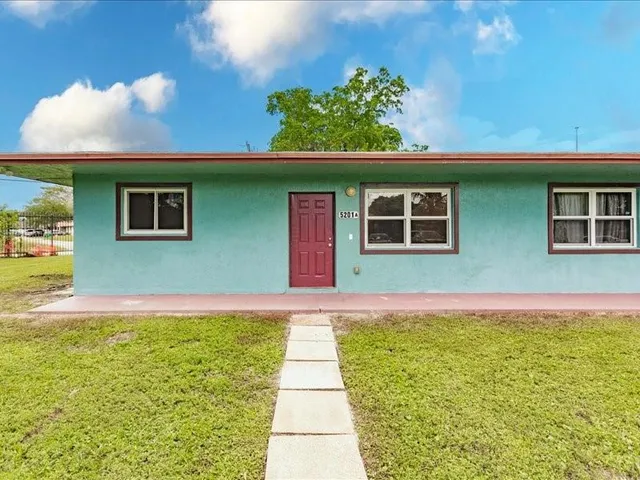a house view with a garden space