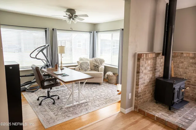 a spacious bedroom with a bed and a flat screen television