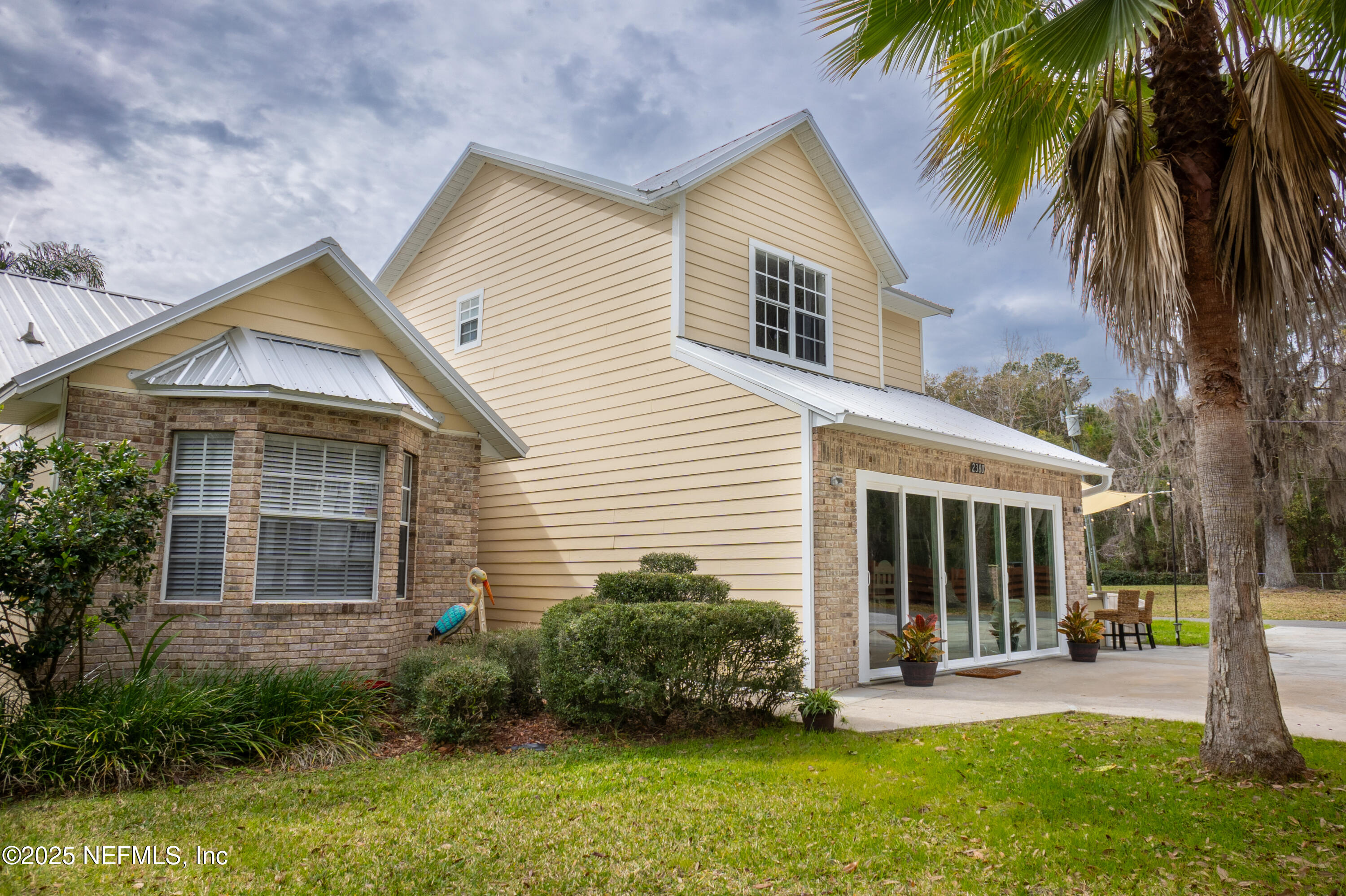 2380 Southeast 43rd Street Keystone Heights, FL 32656 - Photo 4 of 61 a view of a house with a yard and plants