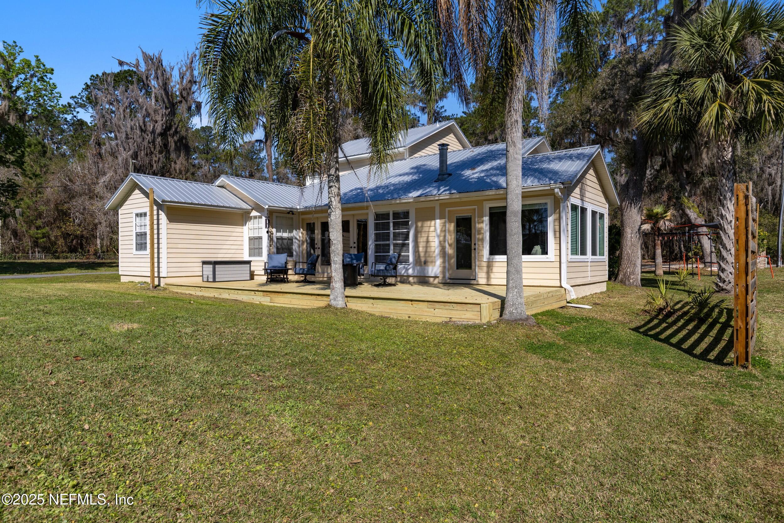 2380 Southeast 43rd Street Keystone Heights, FL 32656 - Photo 48 of 61 a front view of a house with a yard