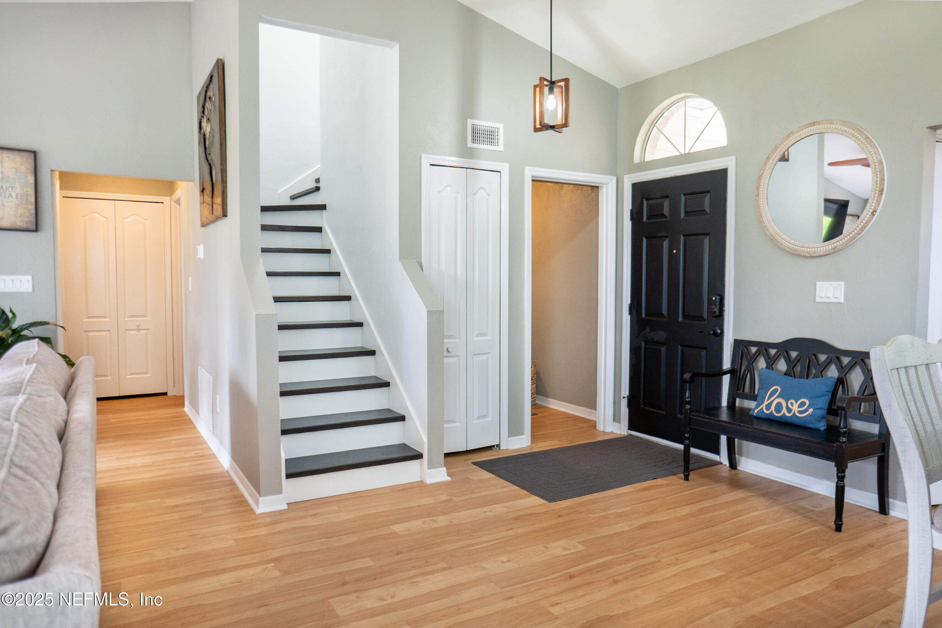 2380 Southeast 43rd Street Keystone Heights, FL 32656 - Photo 5 of 61 a view of a hallway with wooden floor cabinet and mirror