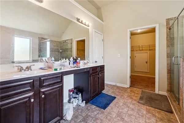 a bathroom with a bathtub and a shower