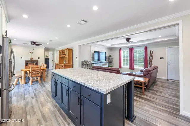 a kitchen with a table and chairs in it