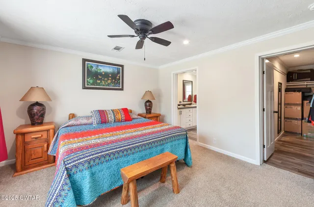 a room with a bed and a chandelier