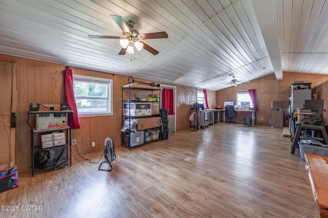 a view of a livingroom with hardwood and furniture