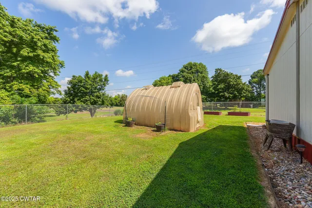 a view of a houses with yard