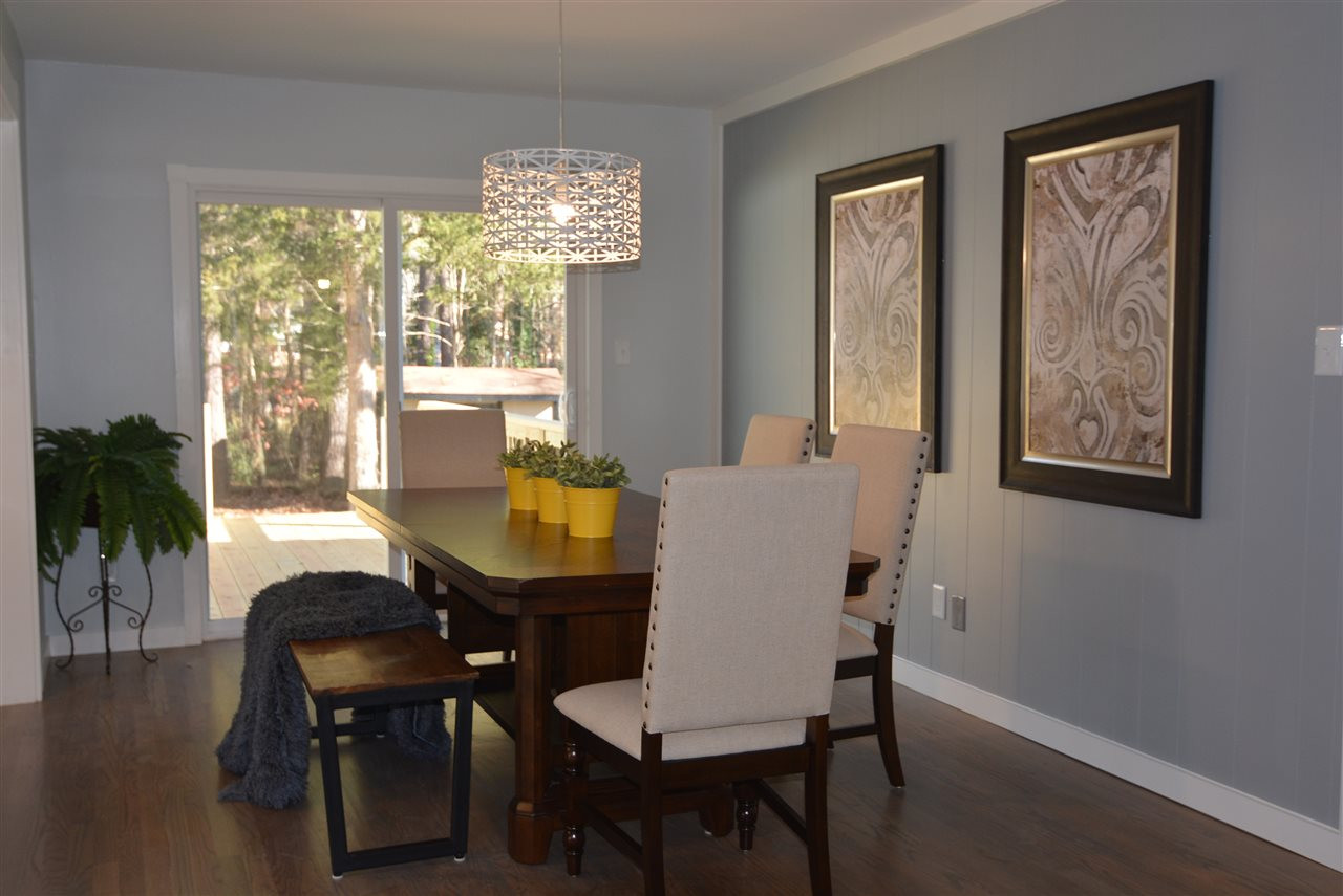 5317 Revere Road Durham, NC 27713 - Photo 3 of 19 a view of a dining room with furniture window and outside view