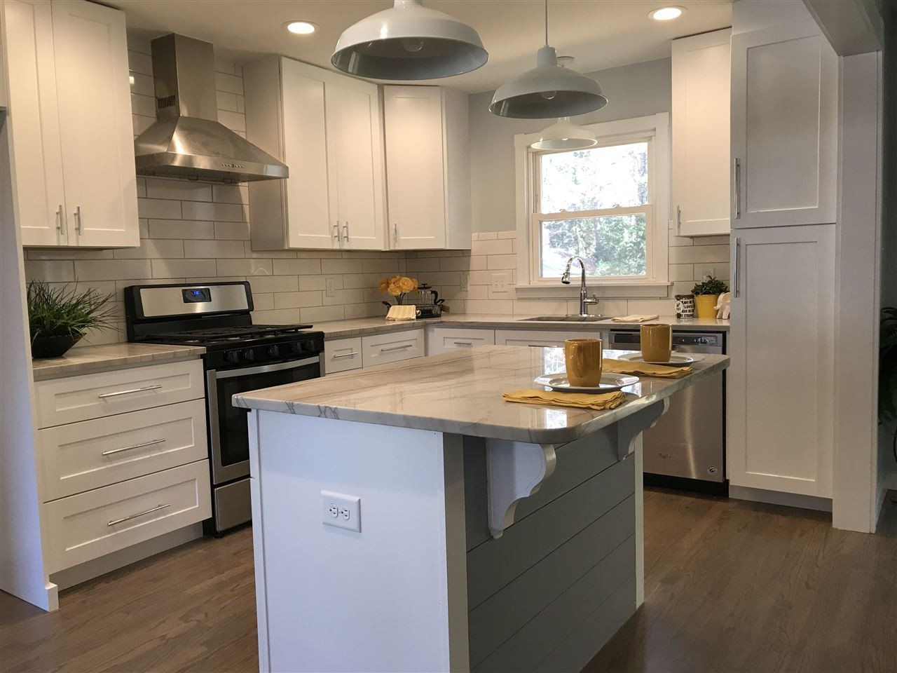 5317 Revere Road Durham, NC 27713 - Photo 4 of 19 a kitchen with granite countertop a sink a counter space appliances and cabinets