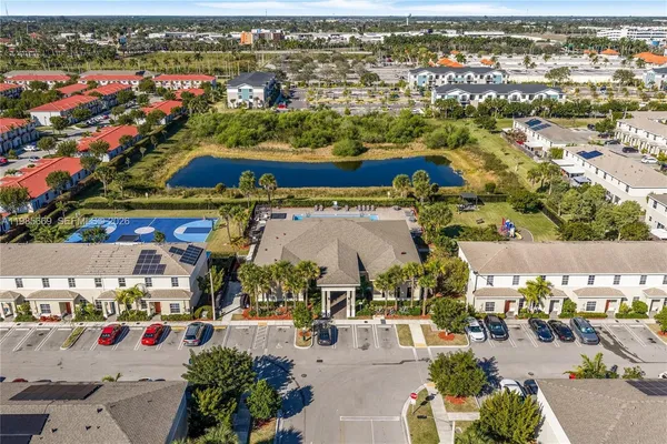 an aerial view of multiple houses with yard