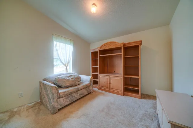 a living room with furniture and windows