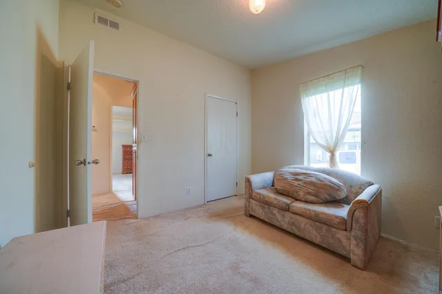 a living room with a couch and a window