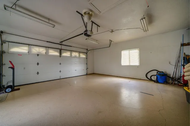 a view of a dining room with furniture and a window