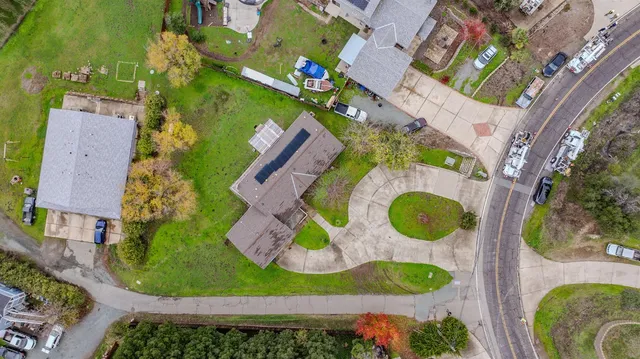 an aerial view of a house with a garden