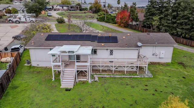 a aerial view of a house with a garden and plants