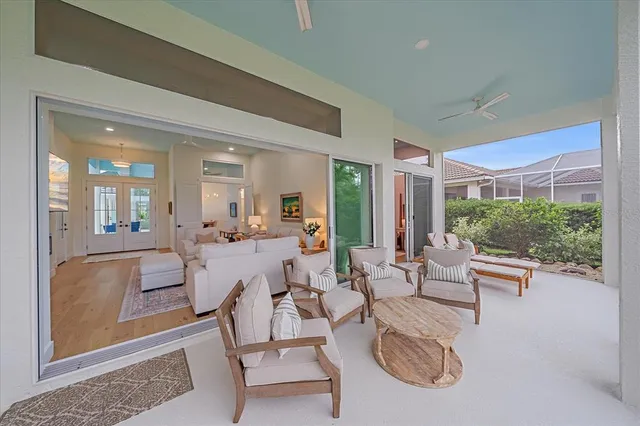 a bathroom with a granite countertop sink a mirror a vanity and a shower