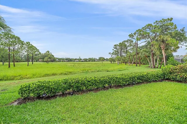 a bedroom with a bed and glass window