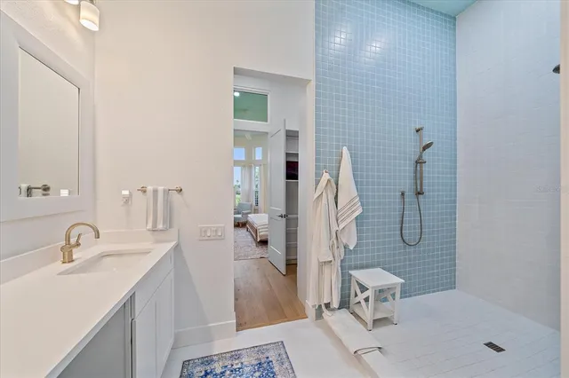 a bathroom with a sink and a mirror