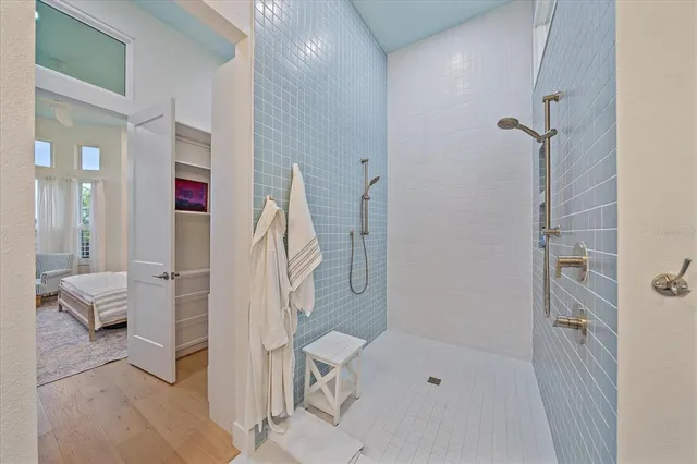 a kitchen that has a lot of cabinets in it and wooden floor