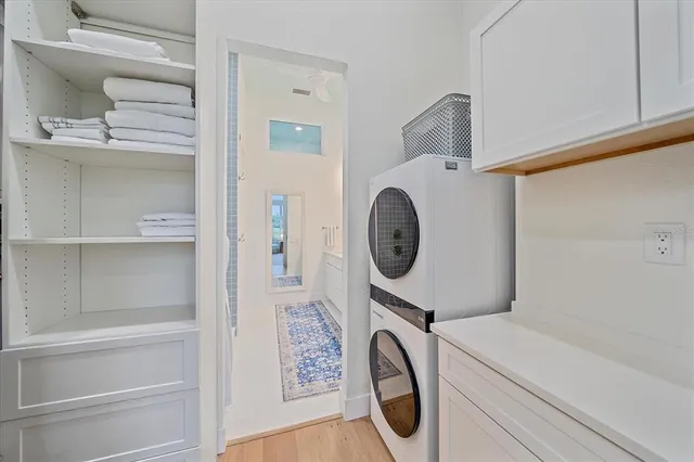 a large white kitchen with a stove a sink and a refrigerator