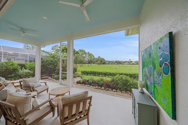 a view of a brick house with a yard and potted plants