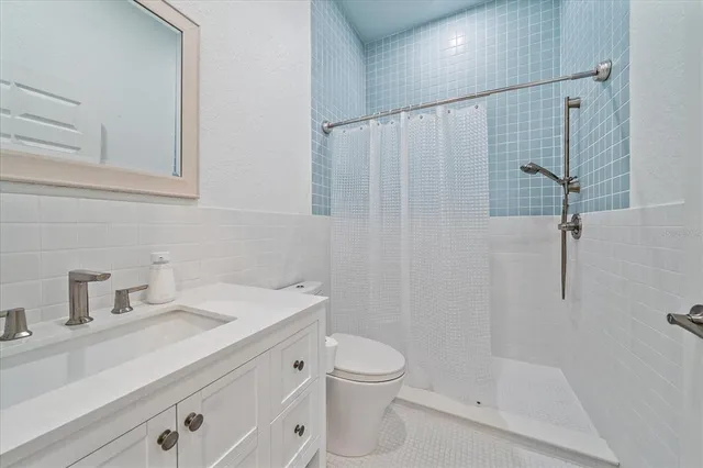 a view of a room with gym equipment and a large window