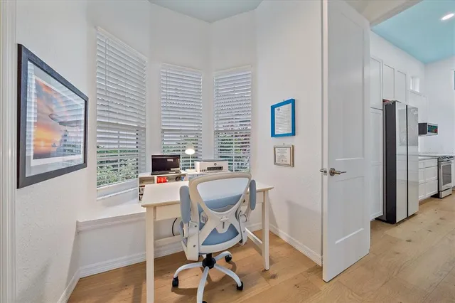 a very nice looking living room with furniture and a large window