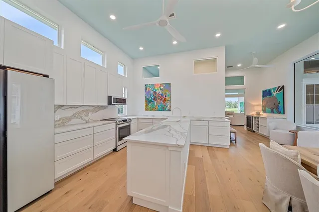 a view of a chairs and table in the patio