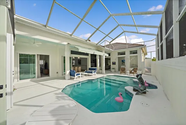 an aerial view of a house with outdoor space and lake view