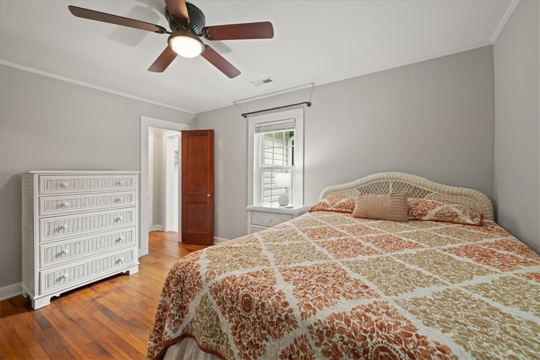 174 Holliday Road Six Mile, SC 29682 - Photo 31 of 49 Hardwood floors and a ceiling fan create a comfortable Primary bedroom