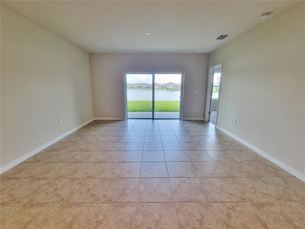 18008 Turning Leaf Circle Land O Lakes, FL 34638 - Photo 12 of 54 a view of an empty room with a window