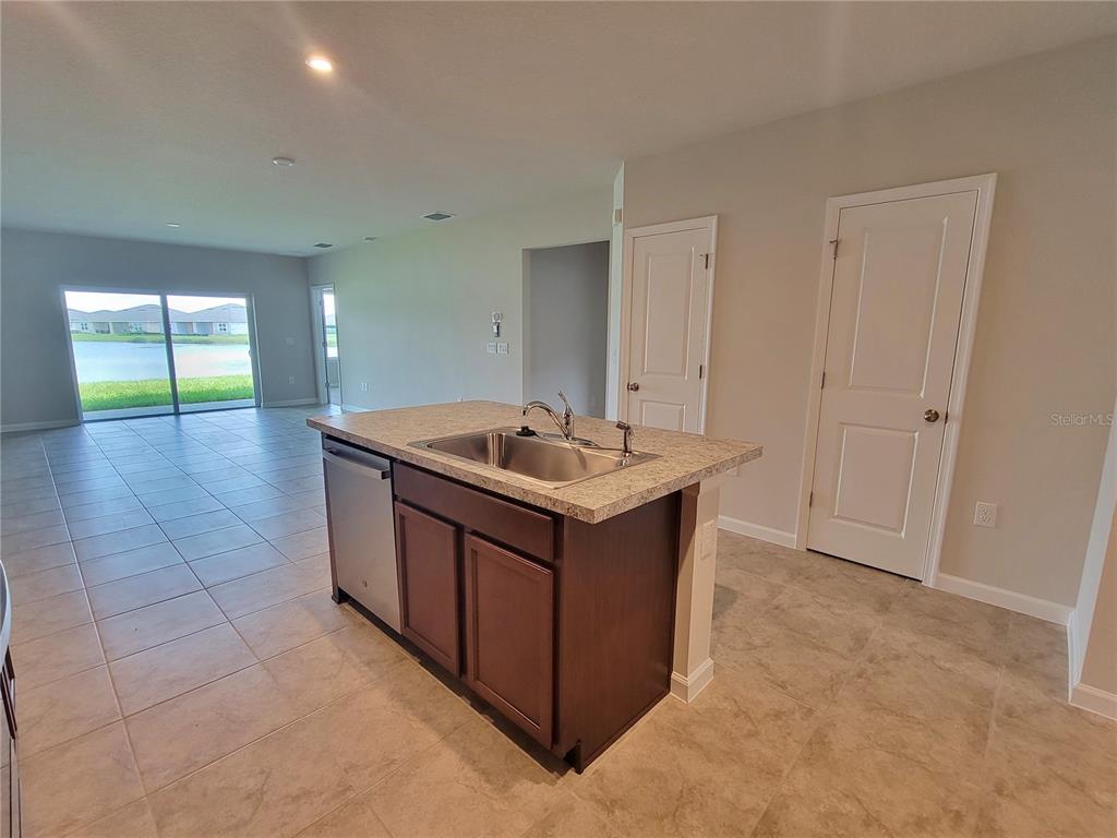 18008 Turning Leaf Circle Land O Lakes, FL 34638 - Photo 23 of 54 a room with a sink and mirror