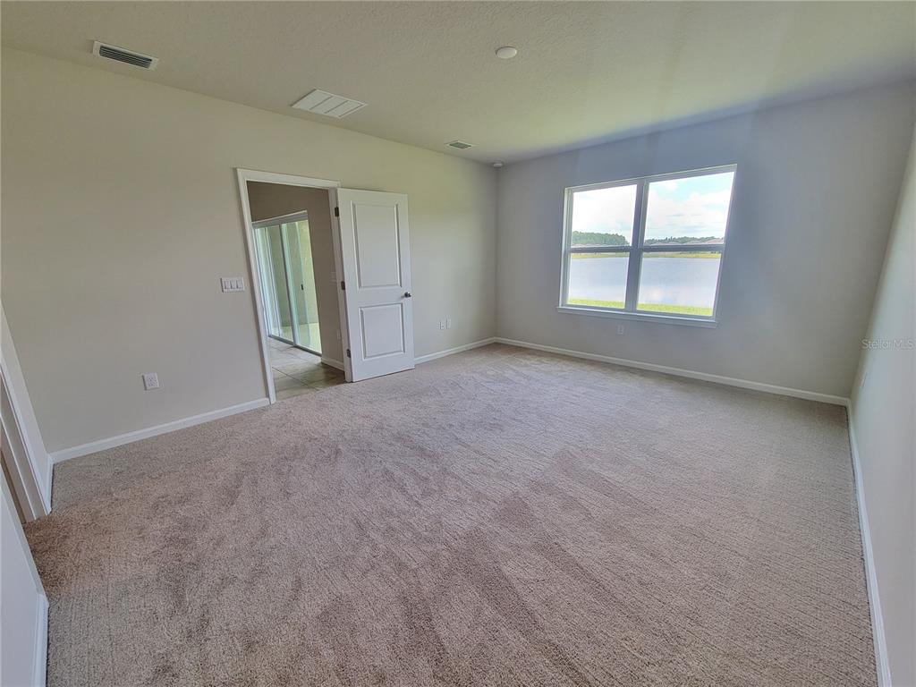 18008 Turning Leaf Circle Land O Lakes, FL 34638 - Photo 26 of 54 an empty room with windows and closet